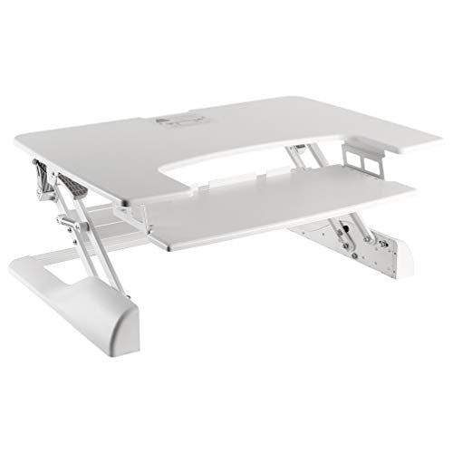 Newstar Sit-Stand Desktop Workstation - White. This ergonomic product holds up to 15kg, while staying steady and solid at any height (13-50cm). Large work surface (90 x 64 cm) accommodates two monitors or a monitor and a laptop. Ergonomic keyboard tray (70 x 30 cm) keeps staggered height between keyboard and monitor to prevent neck strain. Dual squeeze handle gas spring lifting mechanism allows to easily moving the desk up and down, even with your computer equipment. - Newstar have over 20 years